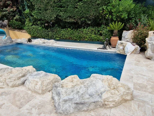 How to enhance your pool with decorative faux rocks? – Poly Rock Concept blog article on faux rocks and decorative rock features
